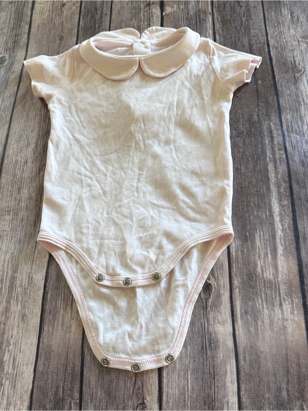 Primary pink bodysuit with collar